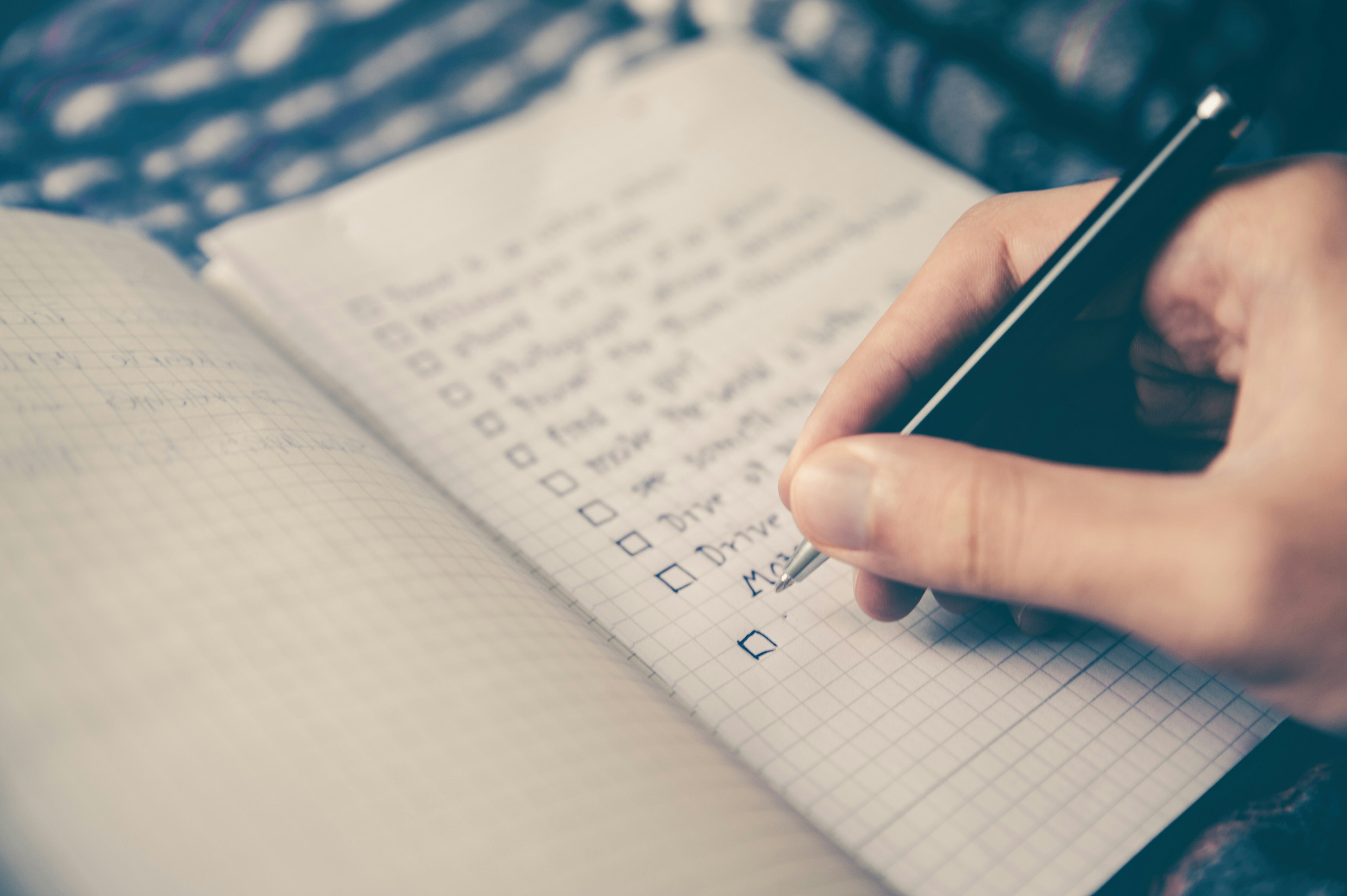 A person recording their goals in a notebook